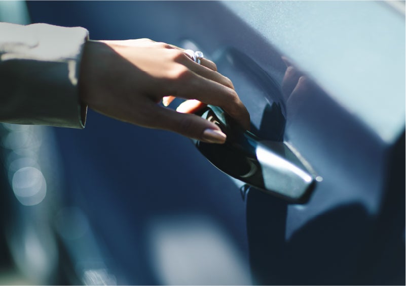 A hand gracefully grips the Light Touch Handle of a 2023 Lincoln Aviator® SUV to demonstrate its ease of use | Sedano Lincoln in La Mesa CA