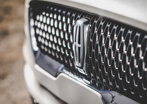The grille of the 2024 Lincoln Aviator® Reserve model with an eye-catching repeated field of Lincoln Star logo shapes | Sedano Lincoln in La Mesa CA