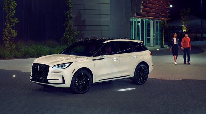 Two people approach a 2024 Lincoln Corsair® SUV featuring the available Jet Appearance Package. | Sedano Lincoln in La Mesa CA