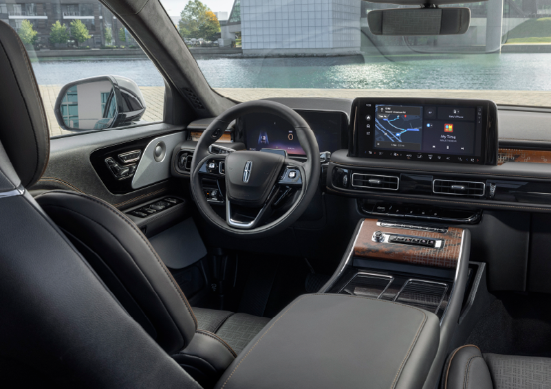 The interior of the 2025 Lincoln Aviator® SUV is shown parked with a view of a harbor through the windshield. | Sedano Lincoln in La Mesa CA