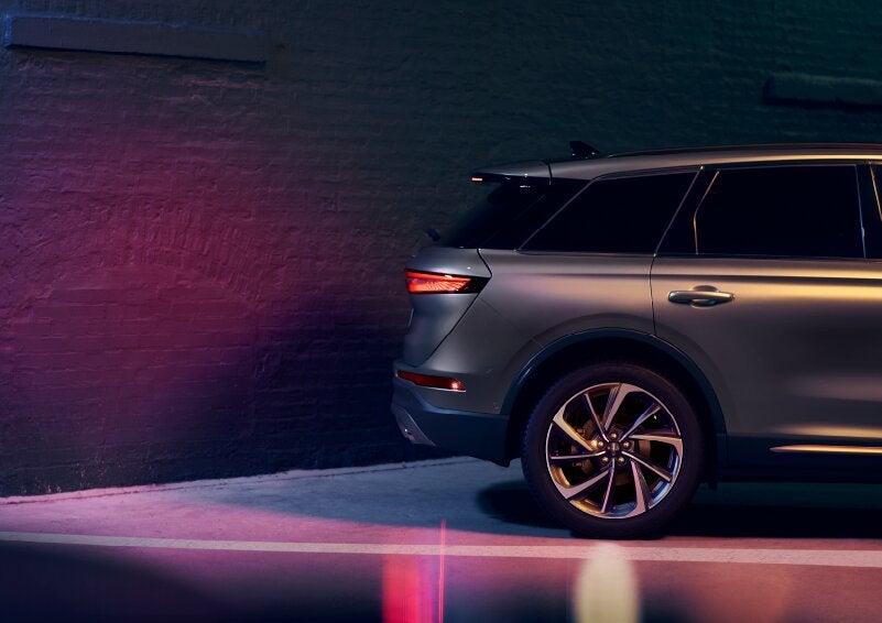 A dramatization of a 2025 Lincoln Corsair® SUV is shown backing up toward a wall. | Sedano Lincoln in La Mesa CA