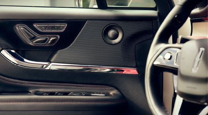 A Revel® audio speaker is shown in the driver's side door of a 2025 Lincoln Corsair® SUV. | Sedano Lincoln in La Mesa CA