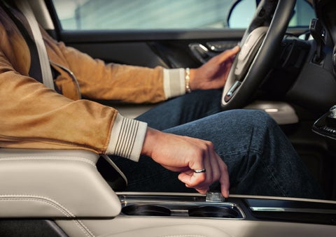 The driver of a 2024 Lincoln Corsair® SUV is shown selecting the drive mode. | Sedano Lincoln in La Mesa CA