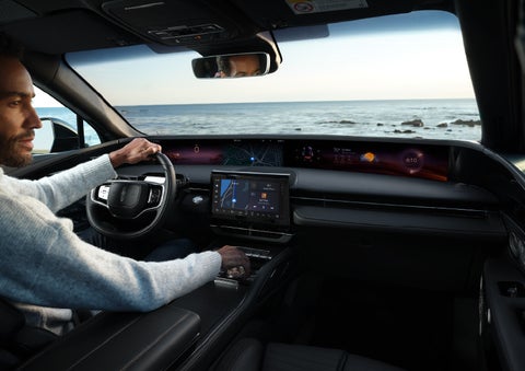 A driver of a parked 2025 Lincoln Nautilus® SUV takes a relaxing moment at a seaside overlook while inside his Nautilus. | Sedano Lincoln in La Mesa CA