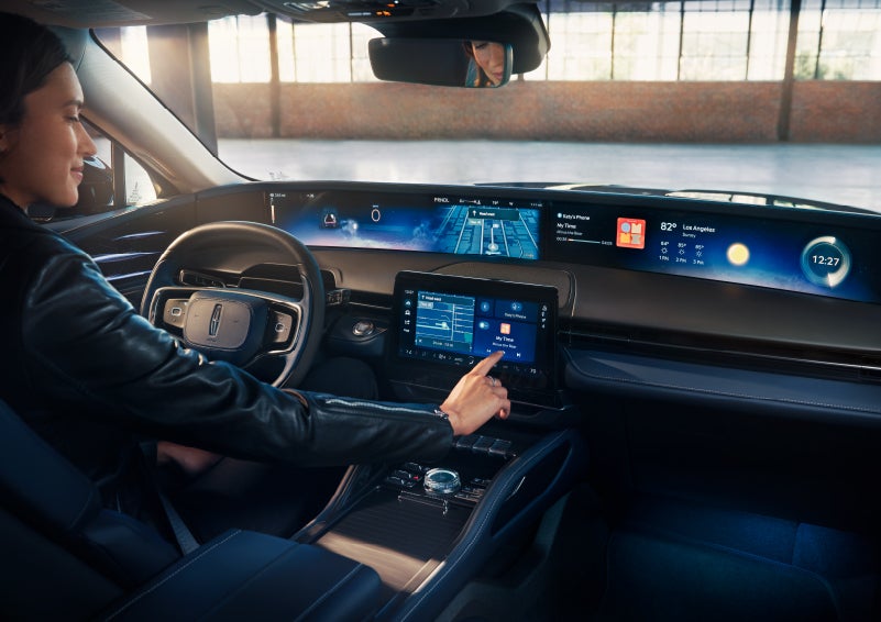 The driver of a 2025 Lincoln Nautilus® SUV interacts with the center touchscreen. | Sedano Lincoln in La Mesa CA