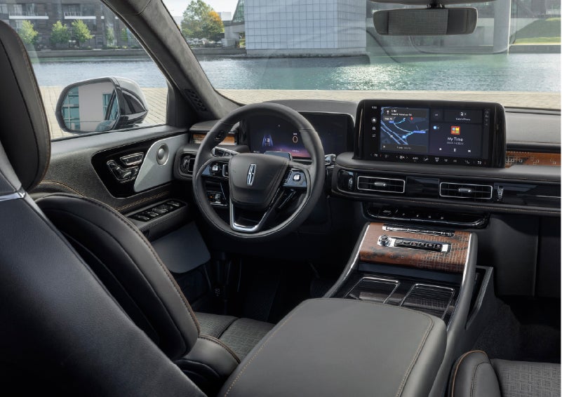 The interior of the 2026 Lincoln Aviator® SUV is shown parked with a view of a harbor through the windshield. | Sedano Lincoln in La Mesa CA