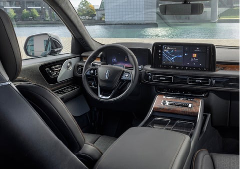 The interior of the 2026 Lincoln Aviator® SUV is shown parked with a view of a harbor through the windshield. | Sedano Lincoln in La Mesa CA