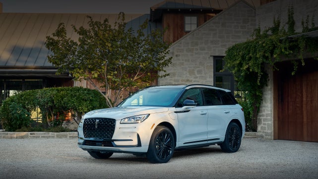 A 2026 Lincoln Corsair® SUV is parked in front off a luxury home. | Sedano Lincoln in La Mesa CA