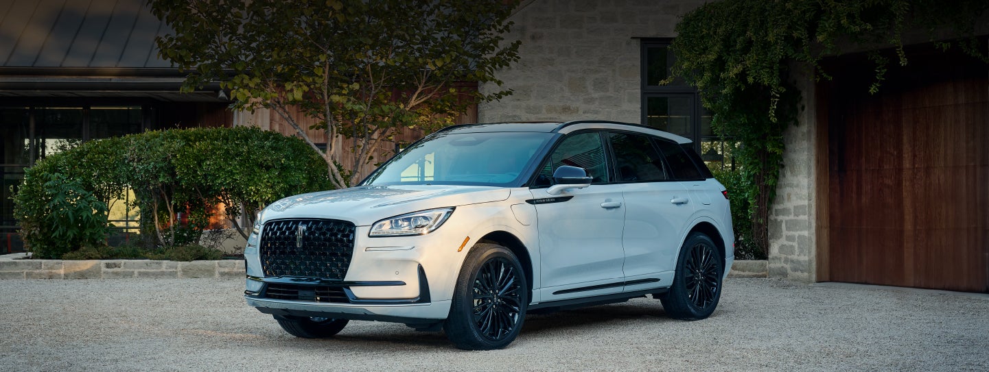 A 2026 Lincoln Corsair® SUV is parked in front off a luxury home. | Sedano Lincoln in La Mesa CA