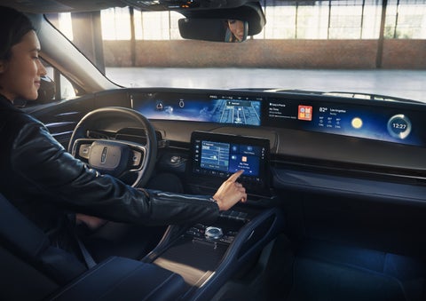 The driver of a 2026 Lincoln Nautilus® SUV interacts with the center touchscreen. | Sedano Lincoln in La Mesa CA