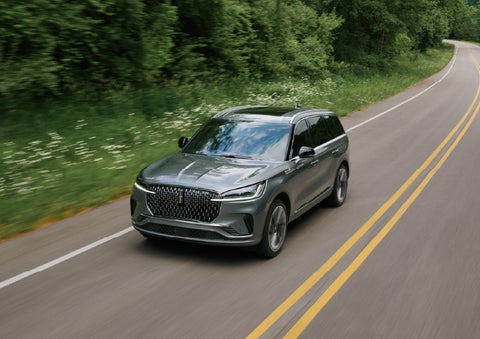 A 2027 Lincoln Aviator® SUV is being driven down a road. | Sedano Lincoln in La Mesa CA