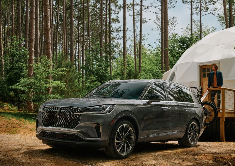 A 2027 Lincoln Aviator® is parked next to a high end glamping site. | Sedano Lincoln in La Mesa CA