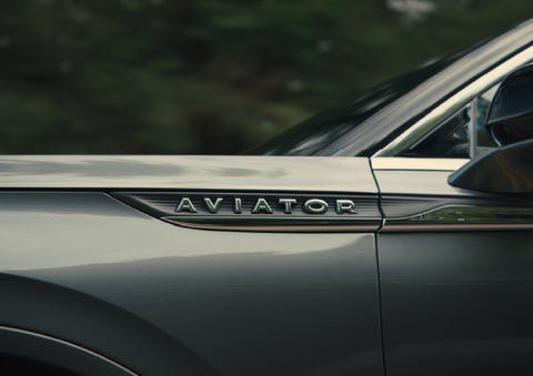 The driver’s side door and fender badging of a gray 2027 Lincoln Aviator® SUV are showcased. | Sedano Lincoln in La Mesa CA