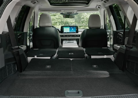 A rear to front view of the interior of a 2027 Lincoln Aviator® Black Label™ SUV shows the third and second rows folded flat | Sedano Lincoln in La Mesa CA