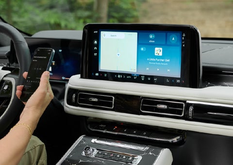 A person pairs thier phone with the center touchscreen of a 2027 Lincoln Aviator® Black Label™ SUV | Sedano Lincoln in La Mesa CA